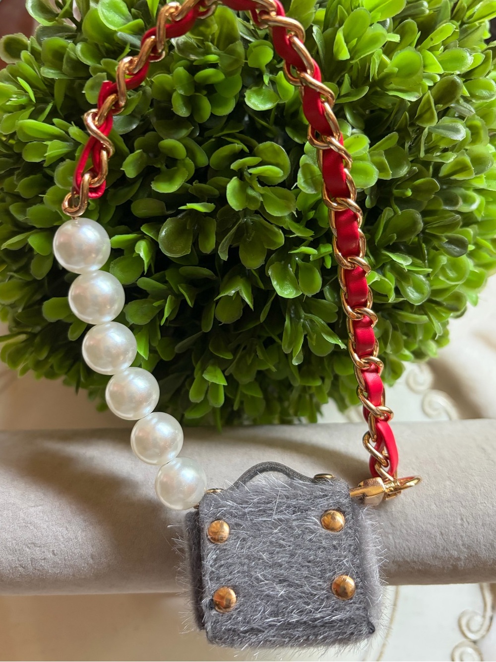 Gray Fuzzy Mini Pouch with Red and gold wristlet strap